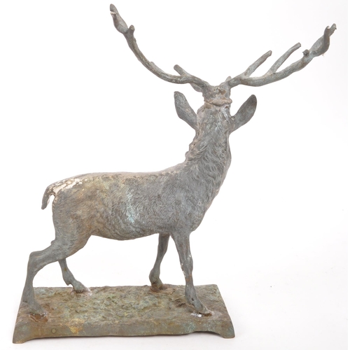 323 - A vintage 20th century cast bronze stag deer. With antler in a standing position on a base with rack... 