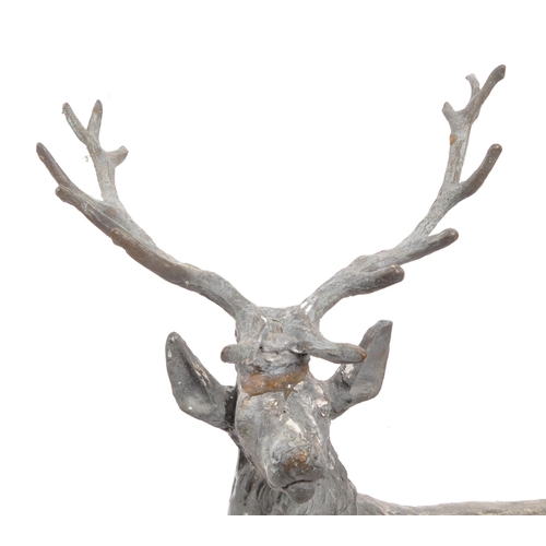 323 - A vintage 20th century cast bronze stag deer. With antler in a standing position on a base with rack... 