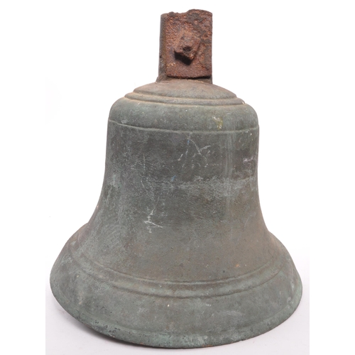 324 - An early 20th century large brass bell, complete with striker, tapering form with rusted fixings. 32... 