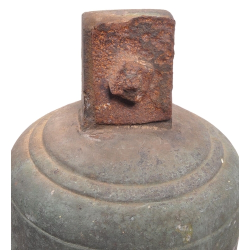 324 - An early 20th century large brass bell, complete with striker, tapering form with rusted fixings. 32... 