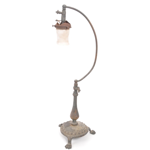 325 - Early 20th century free standing table gas lamp. Brass base with paw feet, curved arm with air flow ... 