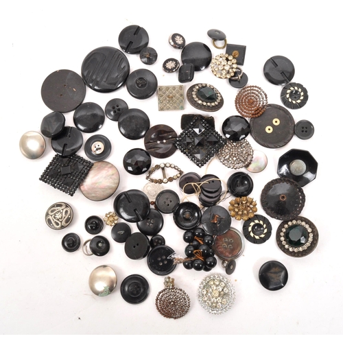 329 - A collection of 20th Century vintage monochrome buttons including 1920s Art Deco examples with later... 