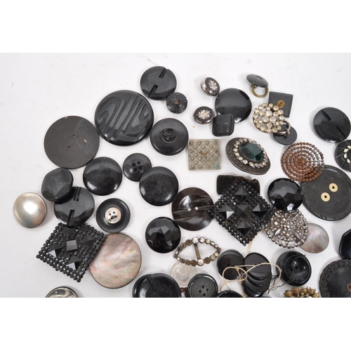 329 - A collection of 20th Century vintage monochrome buttons including 1920s Art Deco examples with later... 