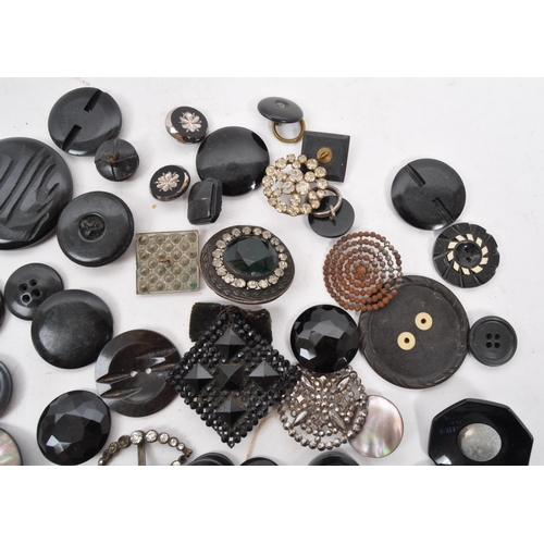 329 - A collection of 20th Century vintage monochrome buttons including 1920s Art Deco examples with later... 