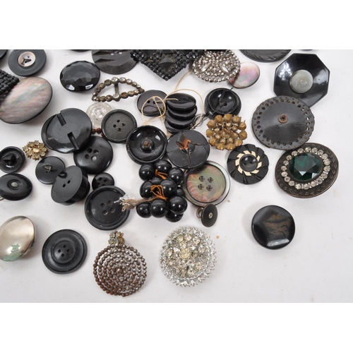 329 - A collection of 20th Century vintage monochrome buttons including 1920s Art Deco examples with later... 