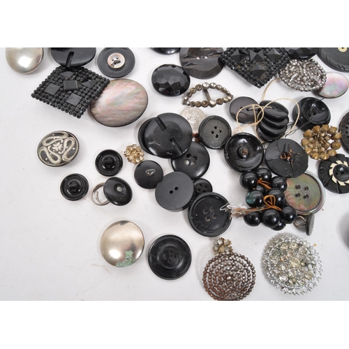 329 - A collection of 20th Century vintage monochrome buttons including 1920s Art Deco examples with later... 