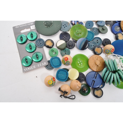 333 - A collection of 20th Century vintage buttons in blue / green colourway. Having varying sizes and sha... 