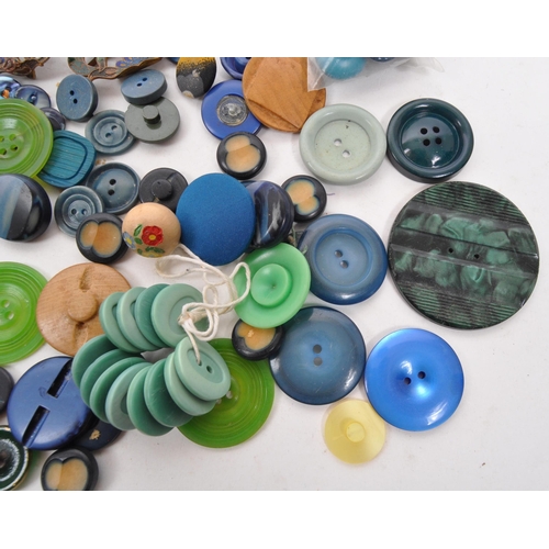 333 - A collection of 20th Century vintage buttons in blue / green colourway. Having varying sizes and sha... 