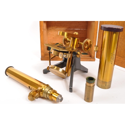 338 - F. Davidson & Co - An early 20th century F. Davidson & Co Scientific brass microscope. The microscop... 