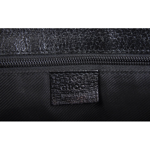 340 - Gucci - A Gucci GG black canvas shoulder / handbag. The bad having leather trim to corners, with bla... 