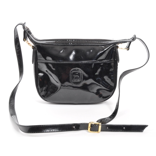 341 - Russell & Bromley - A black patent leather Russell & Bromley handbag. The handbag having impressed R... 