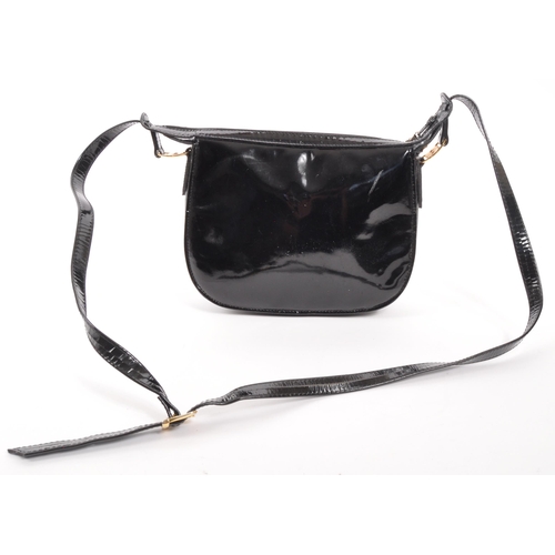 341 - Russell & Bromley - A black patent leather Russell & Bromley handbag. The handbag having impressed R... 