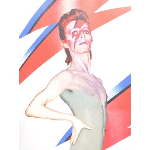 343 - David Bowie - an Aladdin Sane Royal Mail Anniversary Frame. Including five stamps by Royal Mail base... 