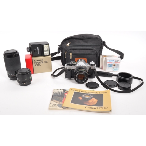 347 - Canon - A late 20th century Canon AE-1 Program 35mm SLR camera with lenses and accessories. The came... 