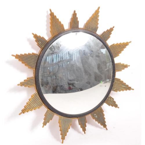 350 - A mid Century circa 1960s sunburst circular mirror with brass surround. Measuring approximately 48cm... 