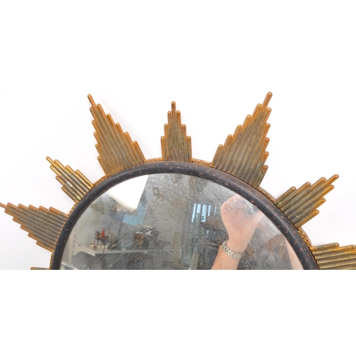 350 - A mid Century circa 1960s sunburst circular mirror with brass surround. Measuring approximately 48cm... 