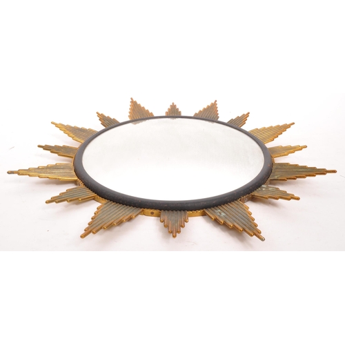 350 - A mid Century circa 1960s sunburst circular mirror with brass surround. Measuring approximately 48cm... 