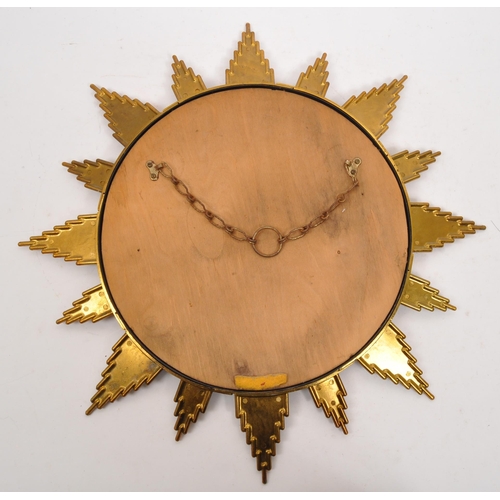 350 - A mid Century circa 1960s sunburst circular mirror with brass surround. Measuring approximately 48cm... 