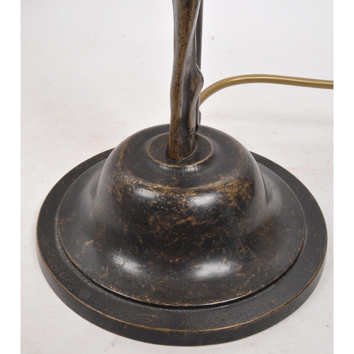 352 - A 20th century Art Deco style brass table lamp. The lamp having a rounded brass base, with nude fema... 