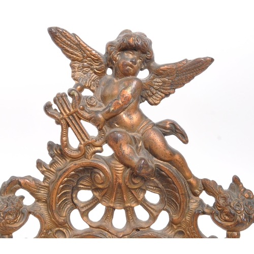 353 - A pair of late 19th Century French decorative brass photo frames with harp playing cherub to top. Th... 