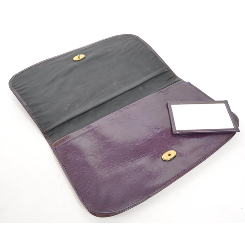 355 - Mulberry - A vintage Mulberry leather clutch bag / purse. The clutch in plum tone leather, with two ... 