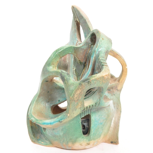 357 - A vintage 20th century studio art pottery 3D sculpture. The abstract sculpture of freeform work fini... 