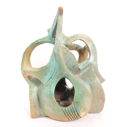 357 - A vintage 20th century studio art pottery 3D sculpture. The abstract sculpture of freeform work fini... 