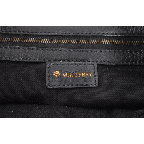 358 - Mulberry - A vintage Mulberry leather handbag. The handbag in a black colourway with twin pockets to... 