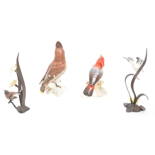 359 - Goebel - A collection of four bird figurines comprising of a china Goebel bird figure, two wrought i... 