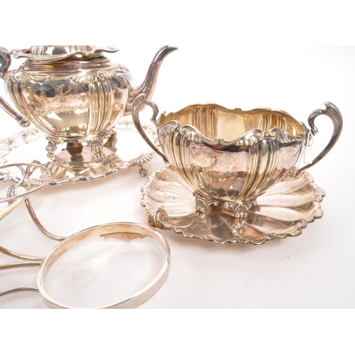 361 - A collection of early 20th century silver plated items. To include two teapots, pair of shell plates... 