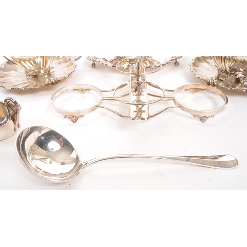 361 - A collection of early 20th century silver plated items. To include two teapots, pair of shell plates... 