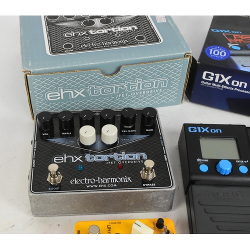 415 - Two guitar multi effects processor pedals. An electro harmonix ehx tortion guitar pedal. With G1Xon ... 