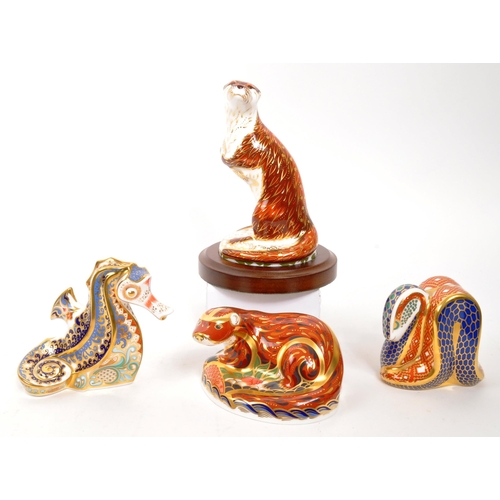 46 - Royal Crown Derby - A collection of four porcelain china Royal Crown Derby paperweight animal figure... 