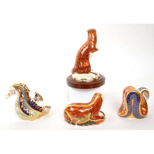 46 - Royal Crown Derby - A collection of four porcelain china Royal Crown Derby paperweight animal figure... 