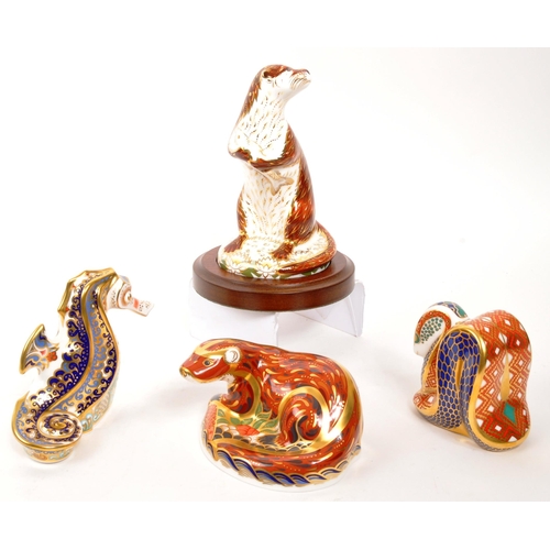 46 - Royal Crown Derby - A collection of four porcelain china Royal Crown Derby paperweight animal figure... 