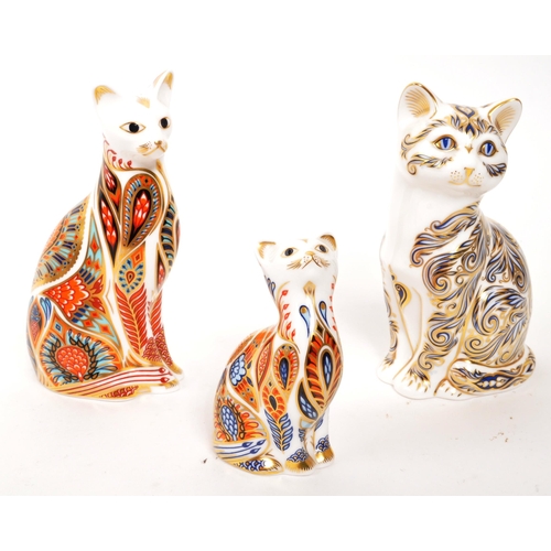 47 - Royal Crown Derby - A collection of three porcelain china Royal Crown Derby paperweight cat figures ... 