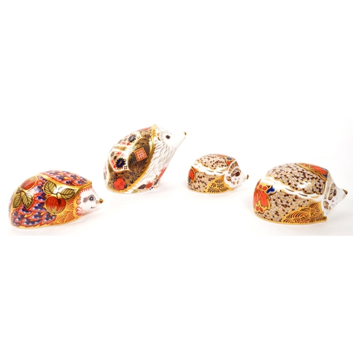 5 - Royal Crown Derby - A collection of four porcelain china hedgehog paperweight figures comprising of ... 