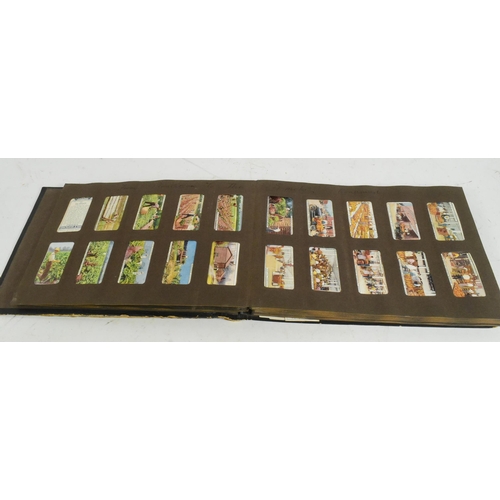 541 - A collection of 20th Century cigarette cards held within album. To include Gilbert and Sullivan issu... 