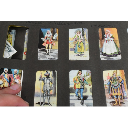 541 - A collection of 20th Century cigarette cards held within album. To include Gilbert and Sullivan issu... 