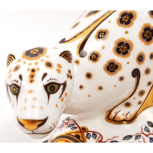 6 - Royal Crown Derby - A porcelain china Royal Crown Derby Snow Leopard paperweight figure with gold st... 