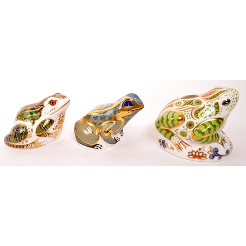 60 - Royal Crown Derby - A collection of three porcelain china Royal Crown Derby paperweight frog figures... 