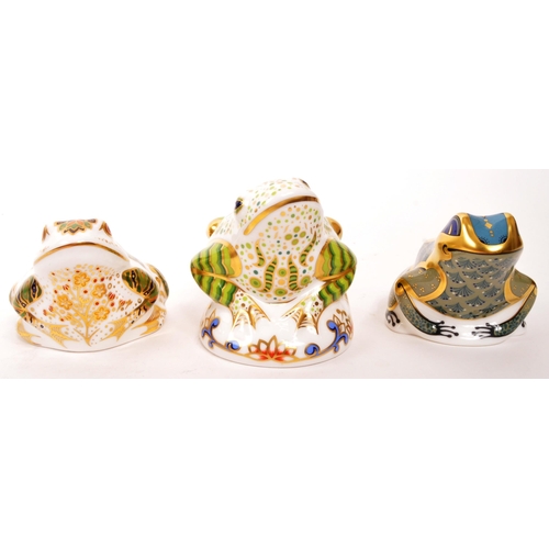 60 - Royal Crown Derby - A collection of three porcelain china Royal Crown Derby paperweight frog figures... 