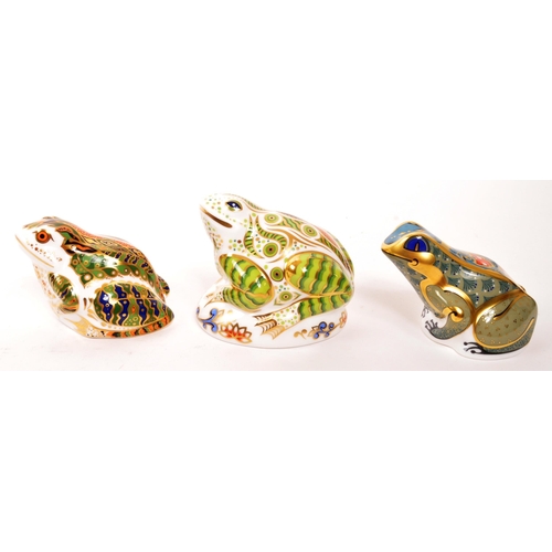 60 - Royal Crown Derby - A collection of three porcelain china Royal Crown Derby paperweight frog figures... 