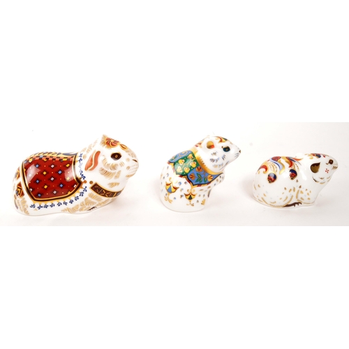 63 - Royal Crown Derby - A collection of three porcelain china Royal Crown Derby paperweights animal figu... 