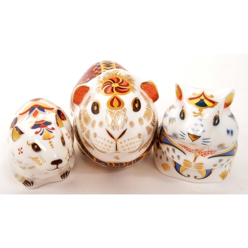 63 - Royal Crown Derby - A collection of three porcelain china Royal Crown Derby paperweights animal figu... 