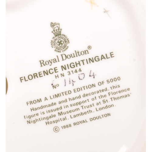 77 - Royal Doulton - A porcelain china Royal Doulton limited edition Florence Nightingale HN3144 figurine... 