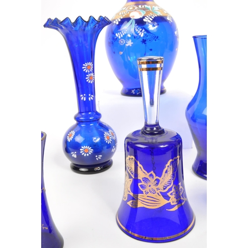 78 - A collection of 19th and 20th century Bristol blue glass pieces. The collection to include a pair of... 