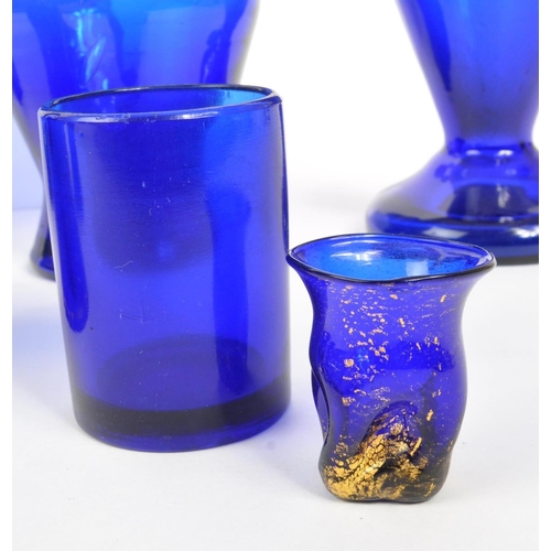 78 - A collection of 19th and 20th century Bristol blue glass pieces. The collection to include a pair of... 