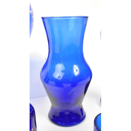 78 - A collection of 19th and 20th century Bristol blue glass pieces. The collection to include a pair of... 