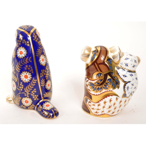 90 - Royal Crown Derby - Two porcelain china Royal Crown Derby paperweight animal figures. Comprising of ... 